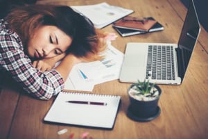 woman-sleeping-at-work_1150-125